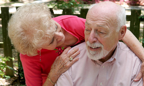 Elderly Couple loving on one another